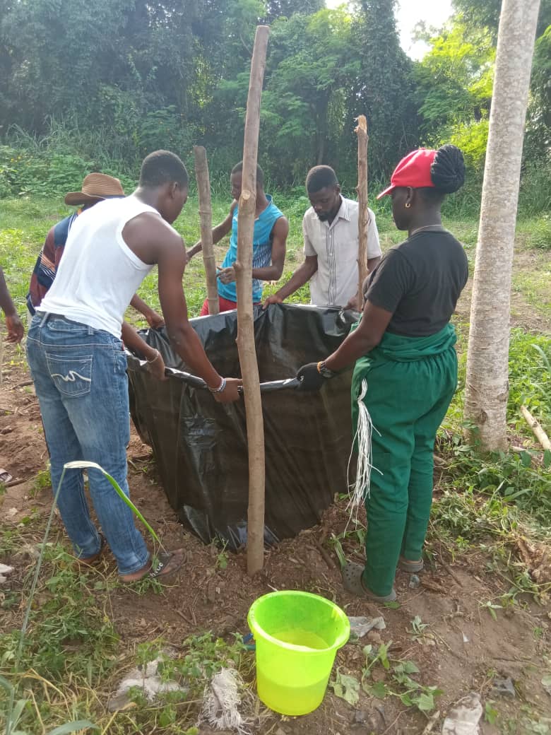 WELP trainees building a compost heap